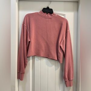 Pink cropped long sleeve top